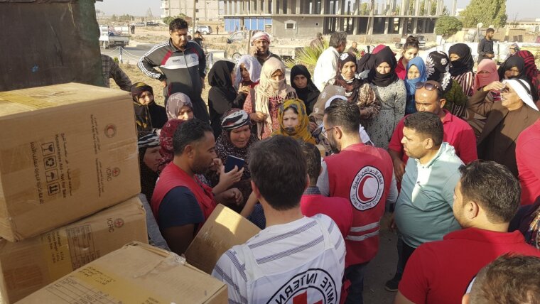 Red Cross distributing packages